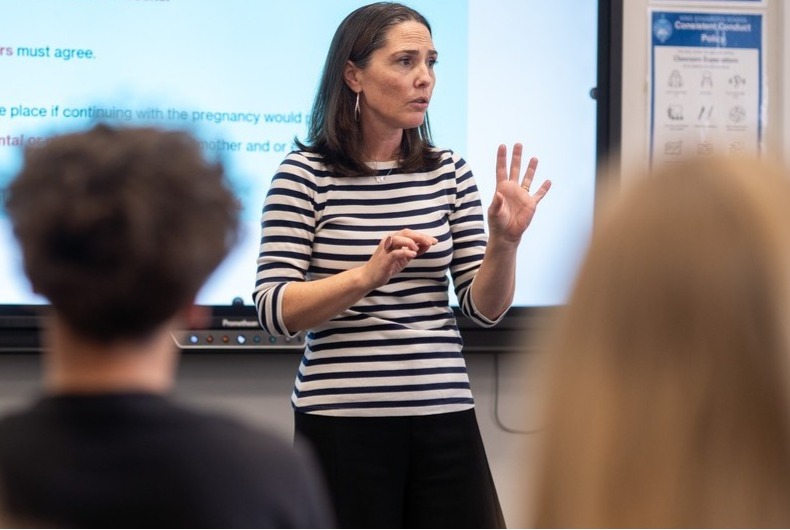 Teacher in front of class